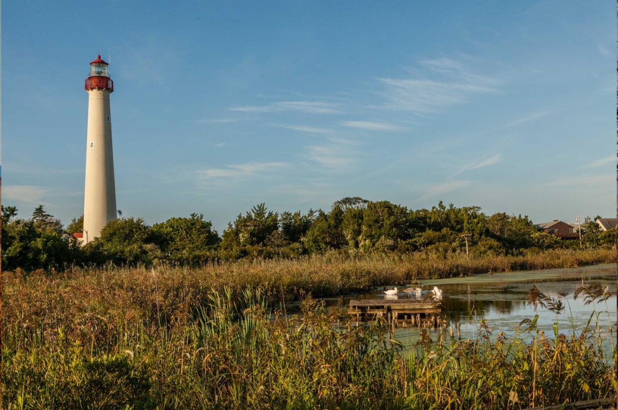 a lighthouse next to a body of water