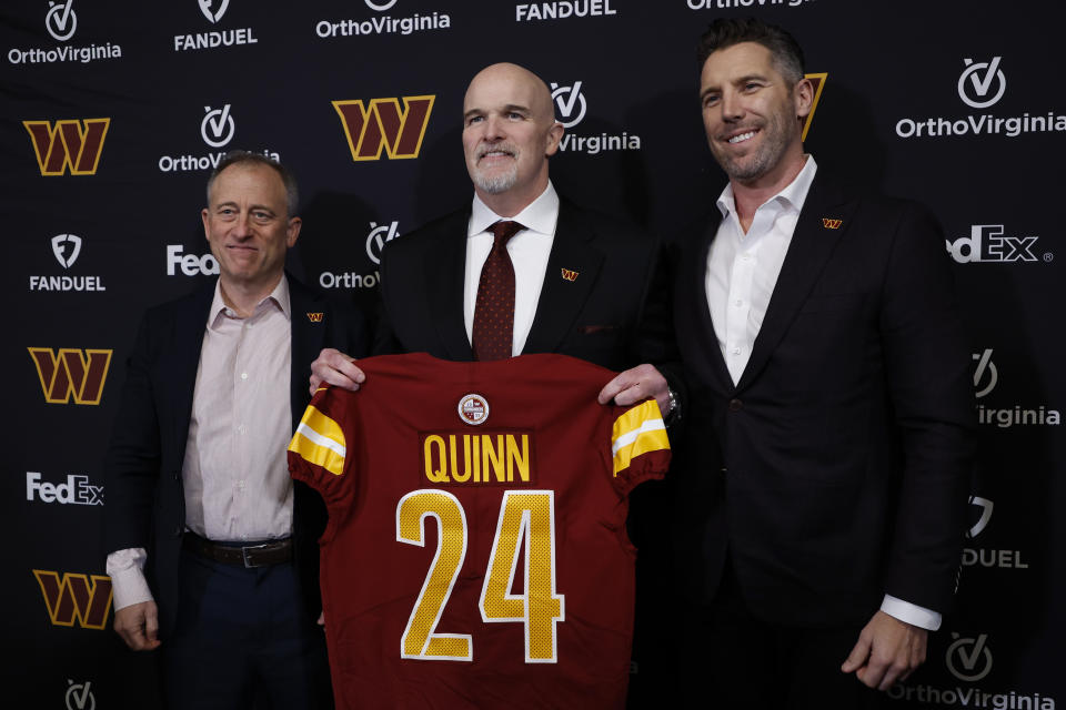 Feb 5, 2024; Ashburn, VA, USA; Washington Commanders head coach Dan Quinn (M) poses for a picture with Commanders managing partner <a class="link " href="https://sports.yahoo.com/nfl/players/26168/" data-i13n="sec:content-canvas;subsec:anchor_text;elm:context_link" data-ylk="slk:Josh Harris;sec:content-canvas;subsec:anchor_text;elm:context_link;itc:0">Josh Harris</a> (L) and Washington Commanders general manager Adam Peters (R) at an introductory press conference at Commanders Park. Mandatory Credit: Geoff Burke-USA TODAY Sports