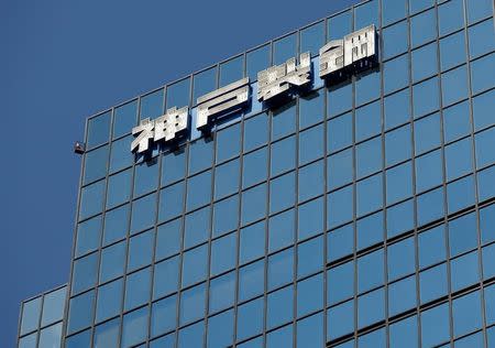 FILE PHOTO: The logo of Kobe Steel is seen on the group's Tokyo headquarter building in Tokyo, Japan October 10, 2017. REUTERS/Issei Kato/File Photo