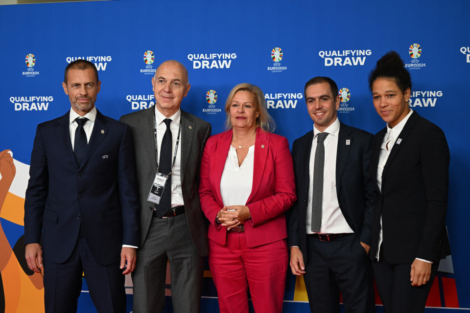 From left, Aleksander Ceferin, UEFA President, Bernd Neuendorf, DFB President, Nancy Faeser (SPD), Federal Minister of the Interior, Philipp Lahm, former soccer player and tournament director of the European Championship, during the draw for the groups to qualify for the 2024 European soccer championship in Frankfurt, Germany, Sunday, Oct.9, 2022. (Arne Dedert/dpa via AP)