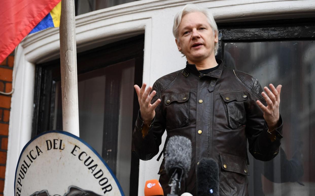 Wikileaks founder Julian Assange speaks on the balcony of the Embassy of Ecuador in London - AFP