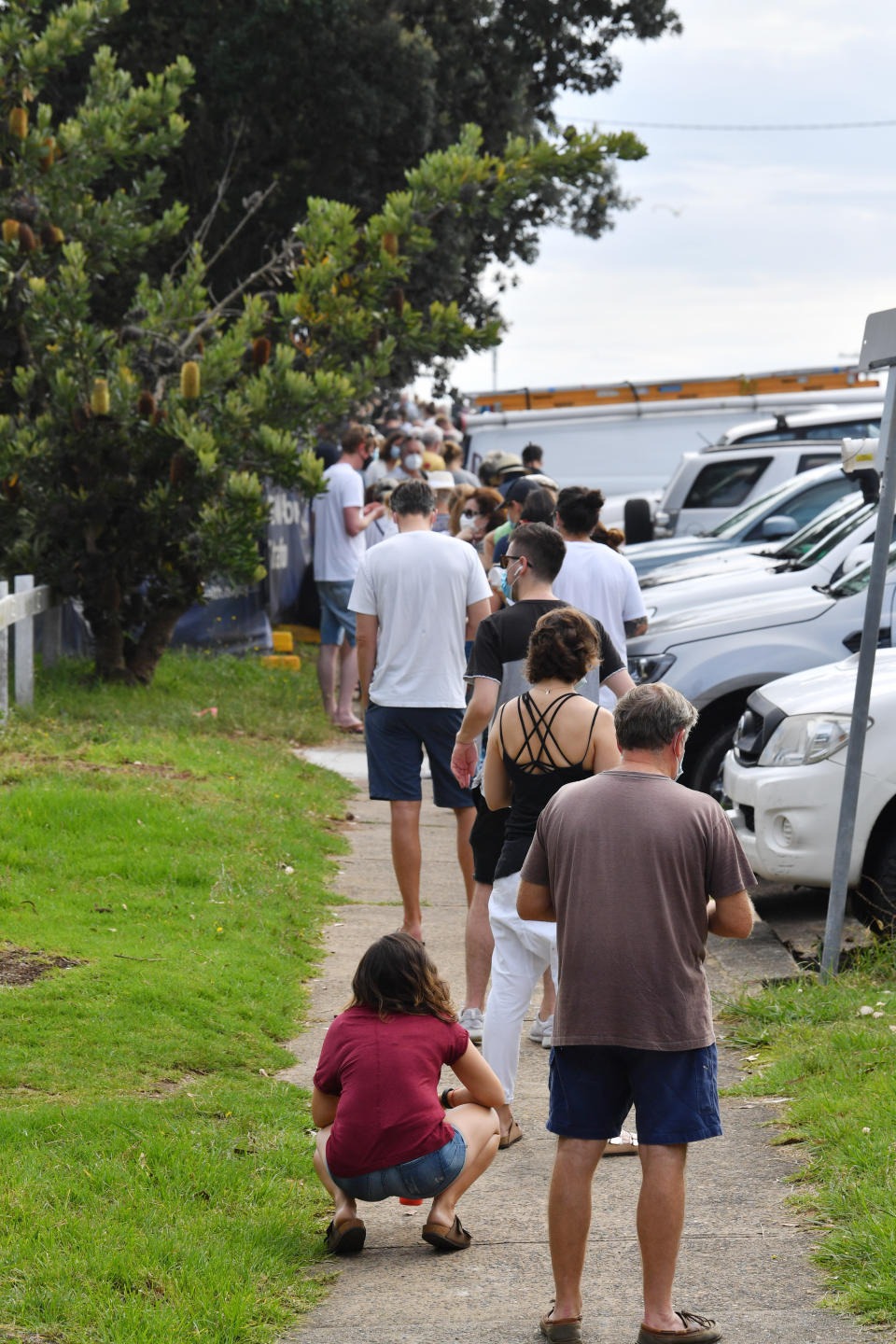 People line up for Covid-19 testing at Mona Vale Hospital's walk-in clinic in Sydney