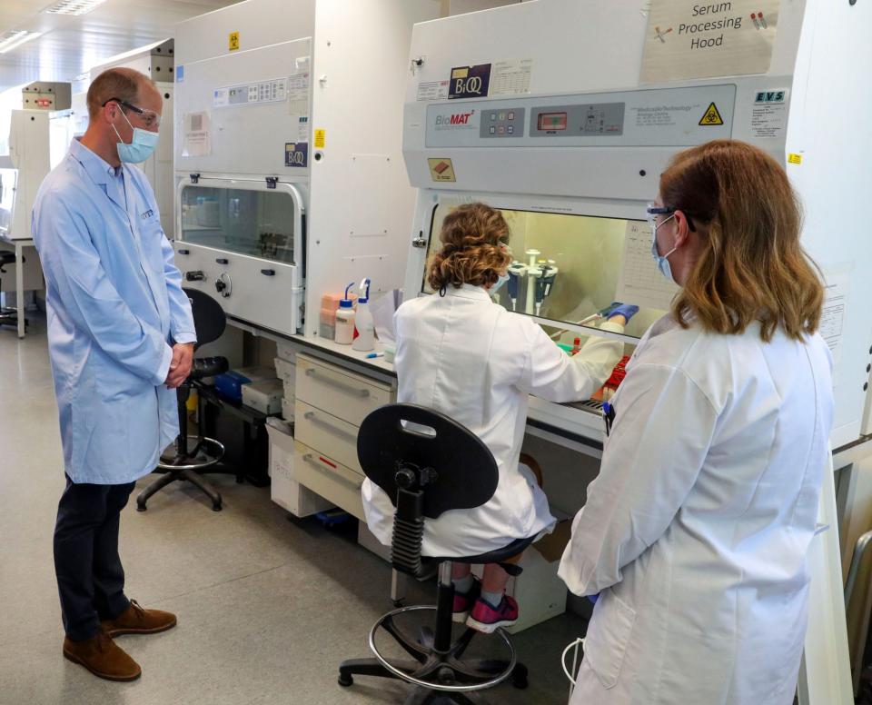 <p>Prince William wears a mask as he meets scientists, including Christina Dold (right), during a visit to the manufacturing laboratory where a vaccine against COVID-19 has been produced at the Oxford Vaccine Group's facility.</p>