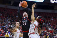 San Diego State guard Abby Prohaska (24) shoots over UNLV forward Nneka Obiazor (1) during the first half of an NCAA college basketball game for the championship of the Mountain West women's tournament Wednesday, March 13, 2024, in Las Vegas. (AP Photo/Ian Maule)