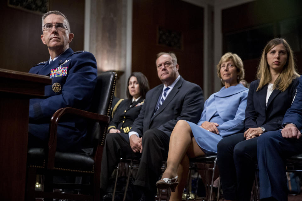 Gen. John Hyten, left, accompanied by members of his family including his wife Laura, second from right, and his daughter Katie, right, appears before the Senate Armed Services Committee on Capitol Hill in Washington, Tuesday, July 30, 2019, for his confirmation hearing to be Vice Chairman of the Joint Chiefs of Staff. (AP Photo/Andrew Harnik)