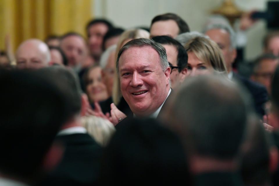 Secretary of State Mike Pompeo smiles as President Donald Trump speaks about him during an event with Israeli Prime Minister Benjamin Netanyahu in the East Room of the White House in Washington, Tuesday, Jan. 28, 2020.