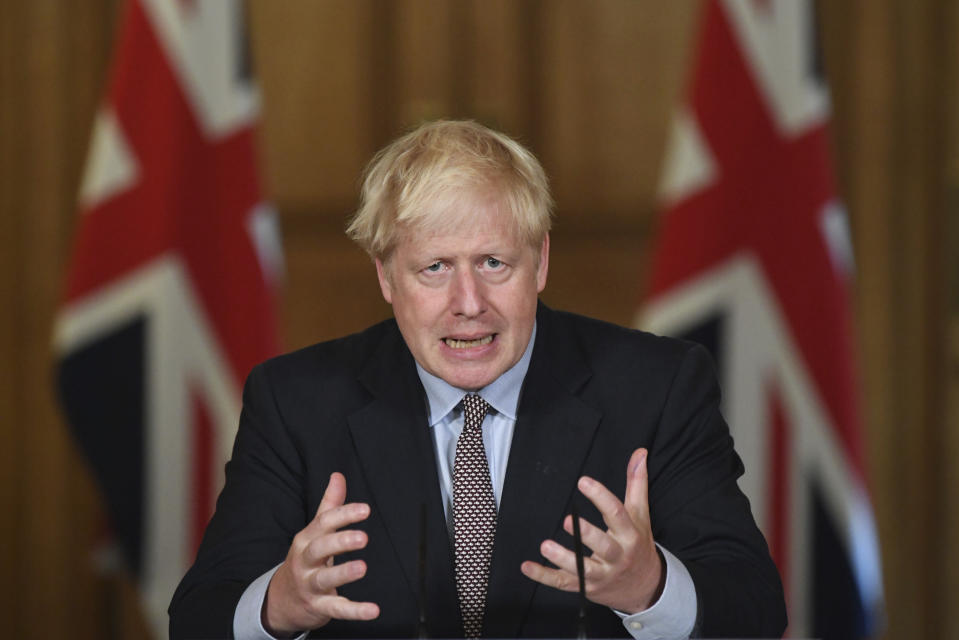 Britain's Prime Minister Boris Johnson speaks during a virtual press conference at Downing Street, London, Wednesday Sept. 9, 2020, following the announcement that the legal limit on social gatherings is set to be reduced from 30 people to six. The change in England will come into force on Monday as the Government seeks to curb the rise in coronavirus cases. (Stefan Rousseau/Pool via AP)