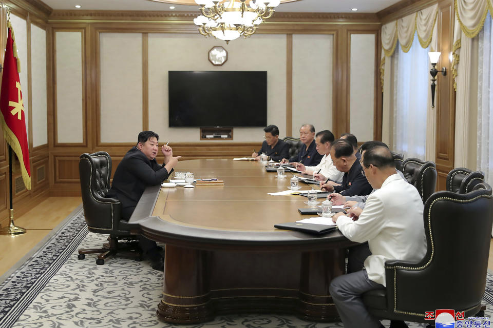 In this photo provided by the North Korean government, North Korean leader Kim Jong Un, left, attends a meeting of the ruling Workers’ Party’s Central Committee in Pyongyang, North Korea Sunday, June 12, 2022. Independent journalists were not given access to cover the event depicted in this image distributed by the North Korean government. The content of this image is as provided and cannot be independently verified. Korean language watermark on image as provided by source reads: "KCNA" which is the abbreviation for Korean Central News Agency. (Korean Central News Agency/Korea News Service via AP)