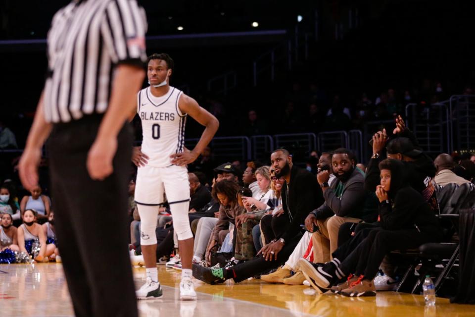 Lebron James watches his son, Sierra Canyon point guard Bronny James, play against his alma mater, St. Vincent-St. Mary