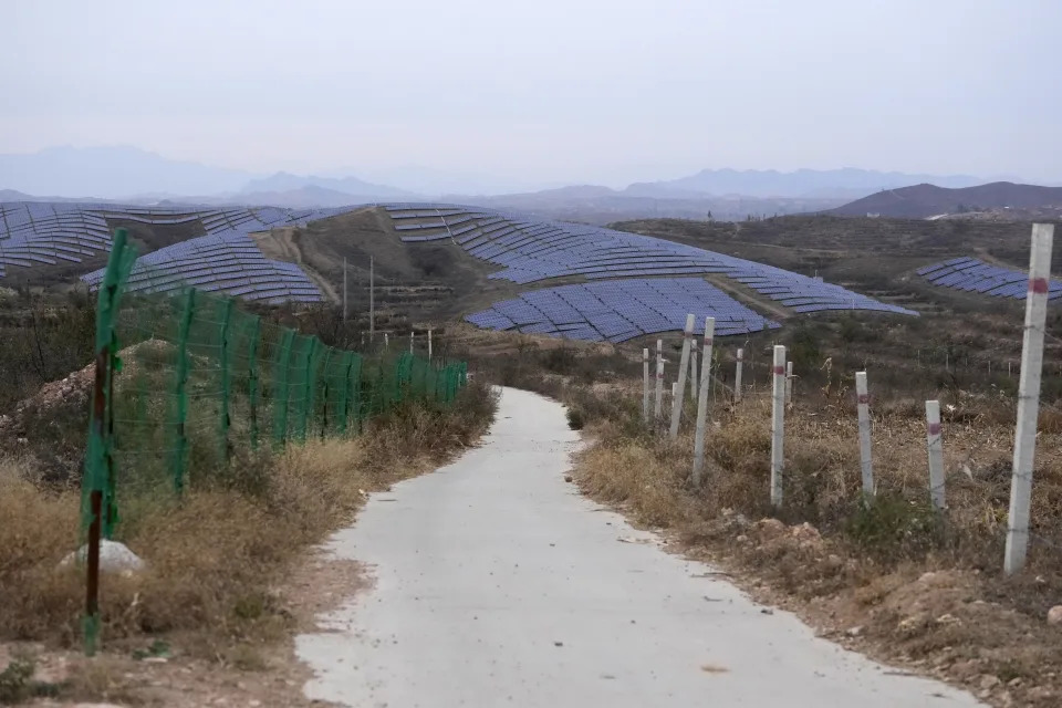 A solar farm is seen next to Donggou village near Shijiazhuang city in the northern China's Hebei province, Friday, Nov. 10, 2023. To meet the goal of limiting global warming to 1.5 degrees Celsius (2.7 degrees Fahrenheit), nine major Asian economies must increase the share of electricity they get from renewable energy from the current 6% to at least 50% by 2030, according to a report by a German thinktank released Wednesday, Nov. 15, 2023. (AP Photo/Ng Han Guan)