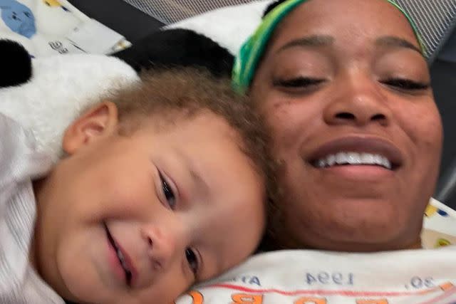 <p>Keke Palmer/Instagram</p> On Mother’s Day 2024, Keke Palmer shared this photo of herself and her son lying in a play pen.