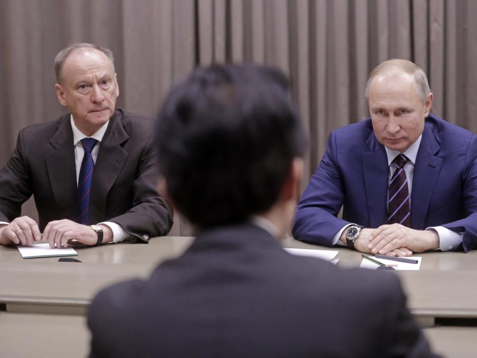 Russian Security Council Secretary Nikolai Patrushev and Russia's President Vladimir Putin during a meeting with the Secretary-General of the Japanese National Security Council.