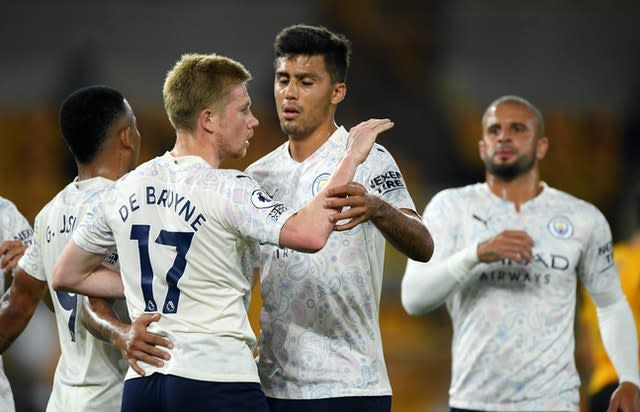 De Bruyne (left) scored a penalty as City won 3-1 at Wolves