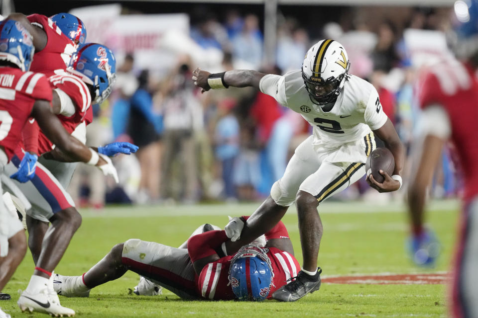 Mississippi defenders sweep down on trapped Vanderbilt quarterback Walter Taylor (2) during the second half of an NCAA college football game in Oxford, Miss., Saturday, Oct. 28, 2023. (AP Photo/Rogelio V. Solis)