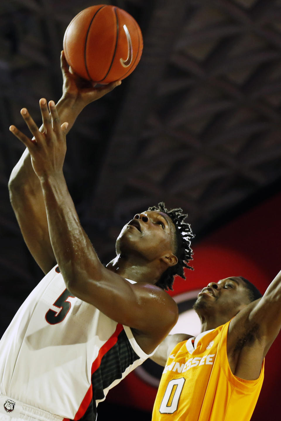 Georgia's Anthony Edwards (5) shoots next to Tennessee guard Davonte Gaines (0) during the first half of an NCAA college basketball game Wednesday, Jan. 15, 2020, in Athens, Ga. (Joshua L. Jones/Athens Banner-Herald via AP)