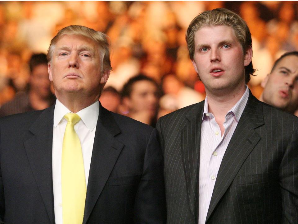 Donald and Eric Trump watch the Tito Ortiz against Lyoto Machida UFC Light Heavyweight fight in 2008, in Las Vegas.