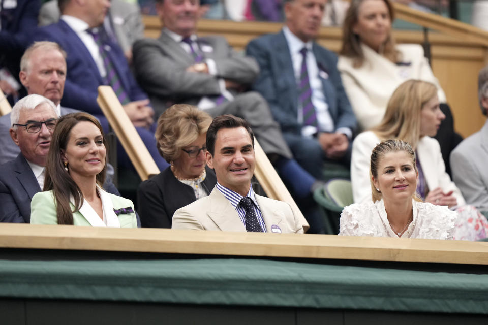 Britain's Kate Princess of Wales, Roger Federer and his wife Mirka Federer, right, sit in the Royal Box at Centre Court on day two of the Wimbledon tennis championships in London, Tuesday, July 4, 2023. Eight-time Wimbledon Champion Roger Federer announced his retirement last year. (AP Photo/Alberto Pezzali)