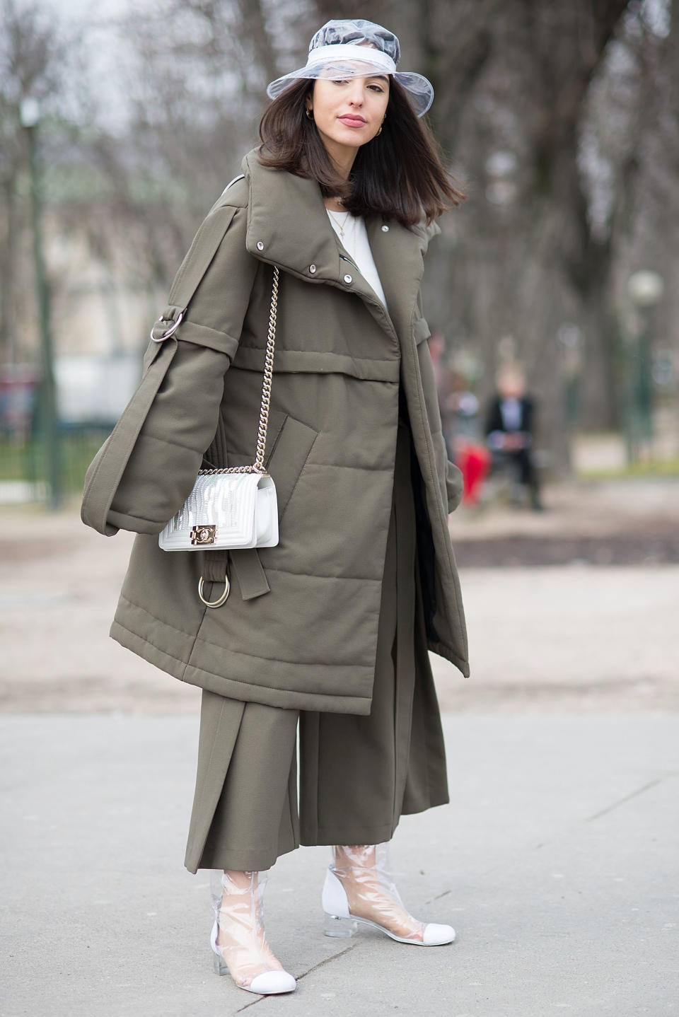 Personal shopper and influencer Bettina Looney wears an Eudon Choi coat and Chanel rain hat, bag and shoes during Paris fashion week on March 6.