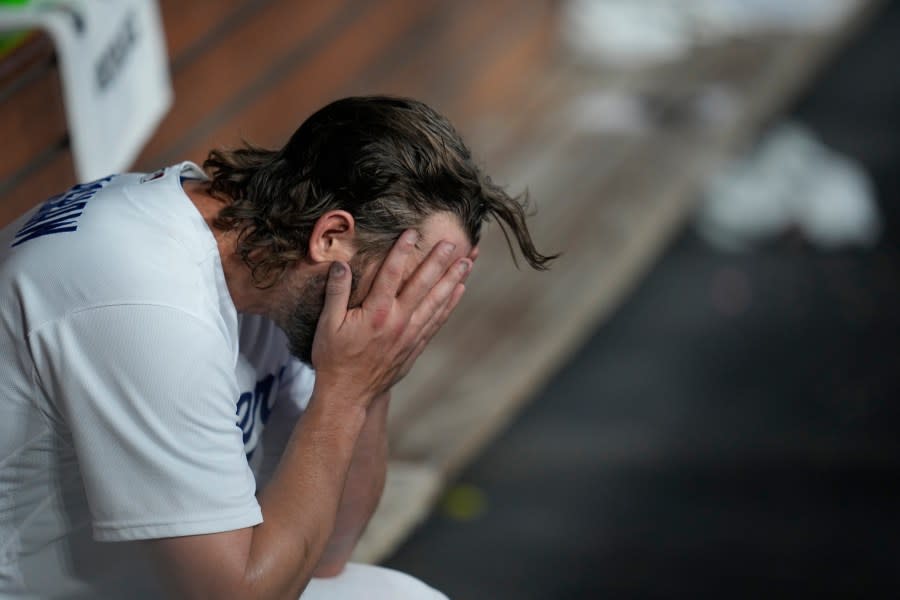 Los Angeles Dodgers starting pitcher Clayton Kershaw reacts after exiting during the first inning in Game 1 of a baseball NL Division Series against the Arizona Diamondbacks, Saturday, Oct. 7, 2023, in Los Angeles. (AP Photo/Ashley Landis)