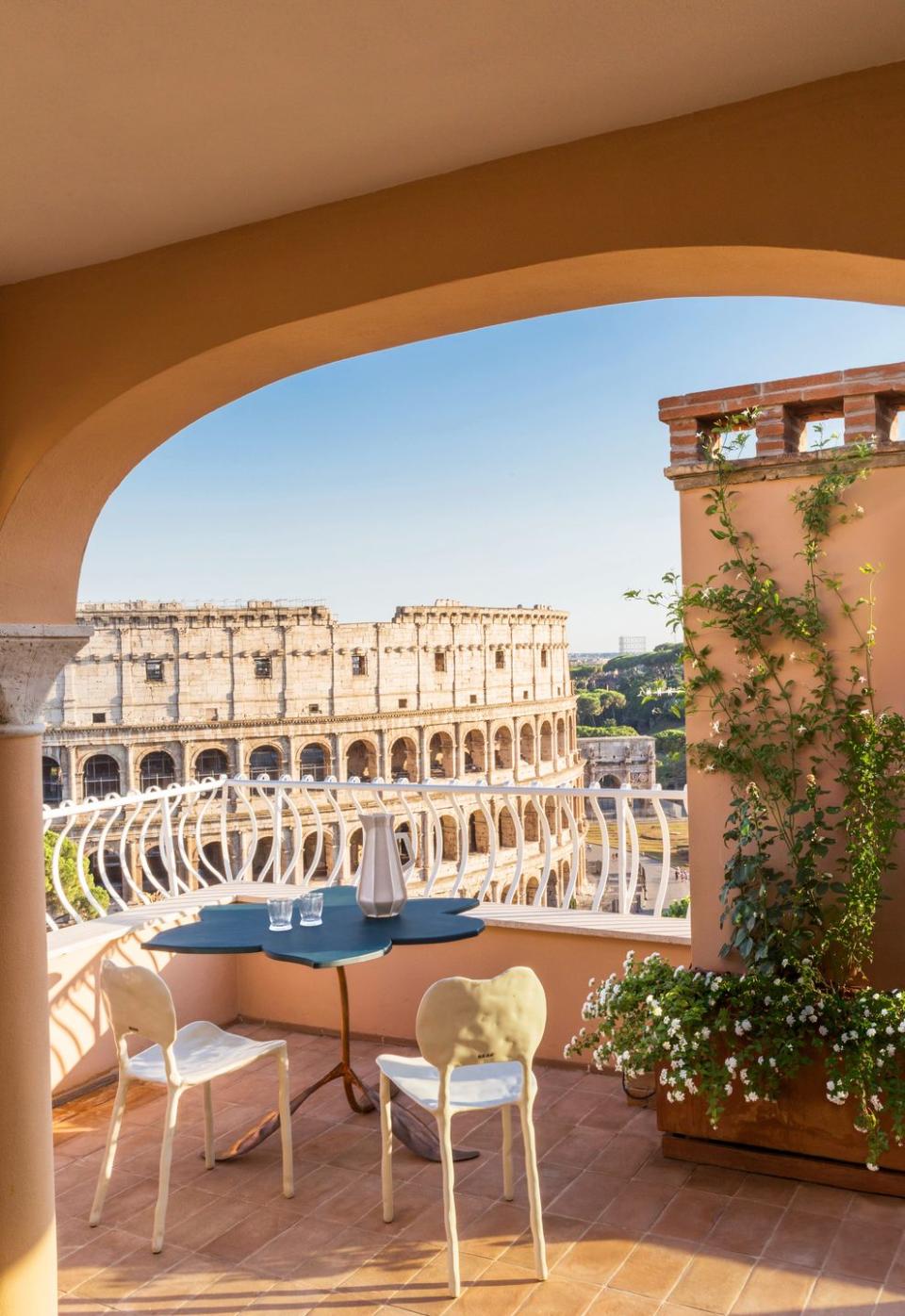 a view of the colosseum from the terrace of a rome apartment by alvisi kirimoto