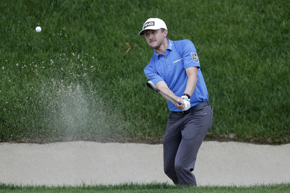 Mackenzie Hughes, of Canada, hits out of a sand trap on the 18th hole during the third round of the Travelers Championship golf tournament at TPC River Highlands, Saturday, June 27, 2020, in Cromwell, Conn. (AP Photo/Frank Franklin II)