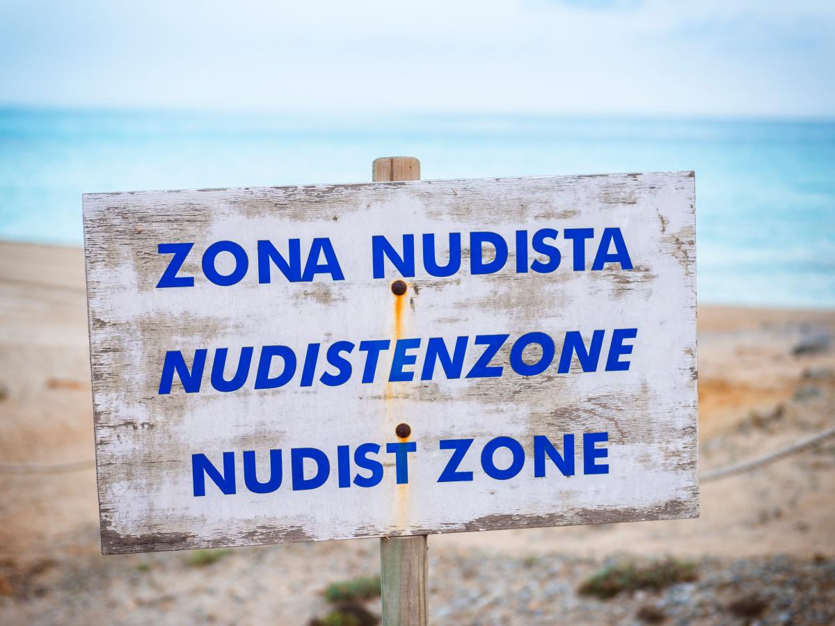 Nudists in Spain want to stop people wearing clothes on the beach because  it makes them feel uncomfortable