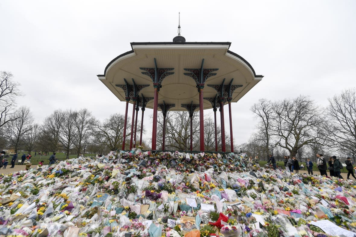 Floral tributes and messages surround the bandstand on Clapham Common in London, March 20, 2021, after the nearby disappearance of Sarah Everard. (AP Photo/Alberto Pezzali, File)