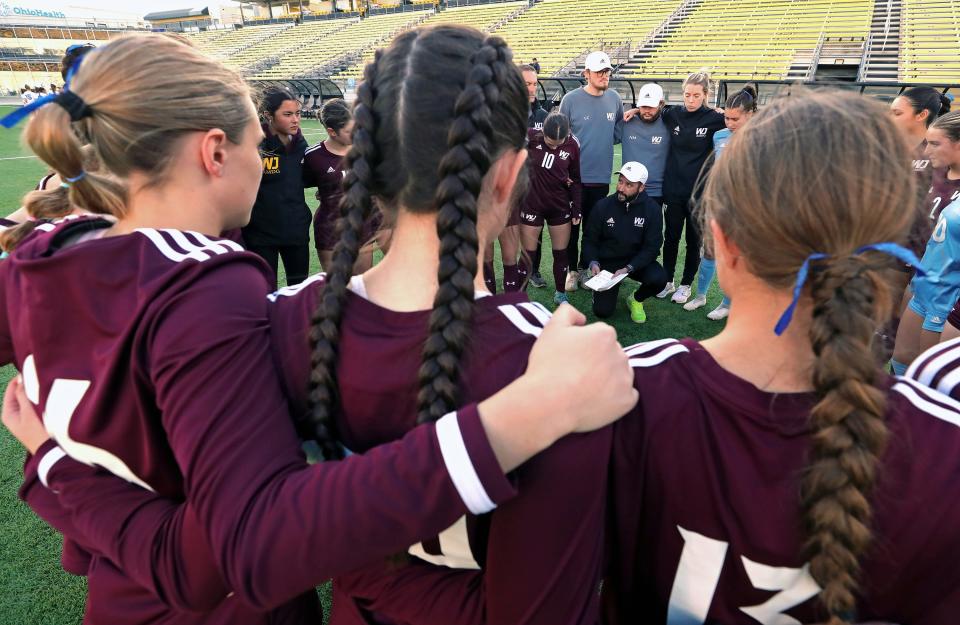 Walsh Jesuit coach Javier Iriart gets his players ready before the OHSAA Division I girls state soccer championship game against Olentangy Liberty on Friday in Columbus.