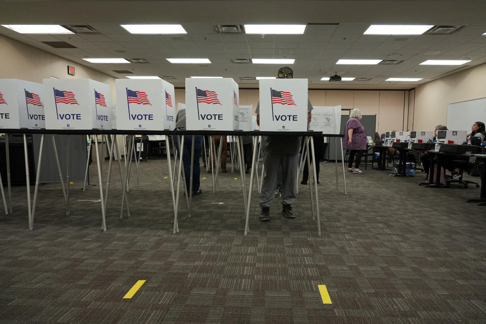 People cast their ballots early for the upcoming midterm elections in Las Cruces, N.M.