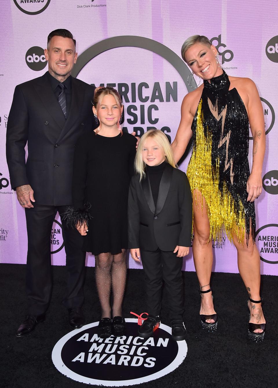 Carey Hart (left), Pink (right) and their children, Willow Sage Hart (second from left) and Jameson Moon Hart at the American Music Awards in 2022.
