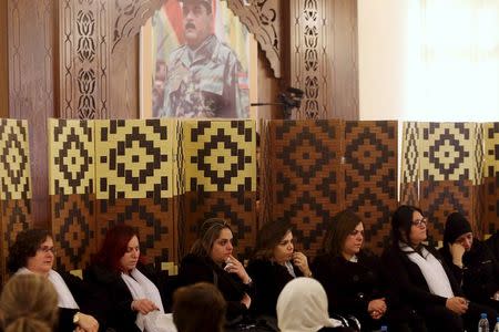 Relatives of Lebanese Hezbollah militant leader Samir Qantar who was killed in an Israeli air strike in Damascus early on Sunday, mourn as they accept condolences for his death in Beirut's southern suburbs, Lebanon December 20, 2015. REUTERS/ Hasan Shaaban