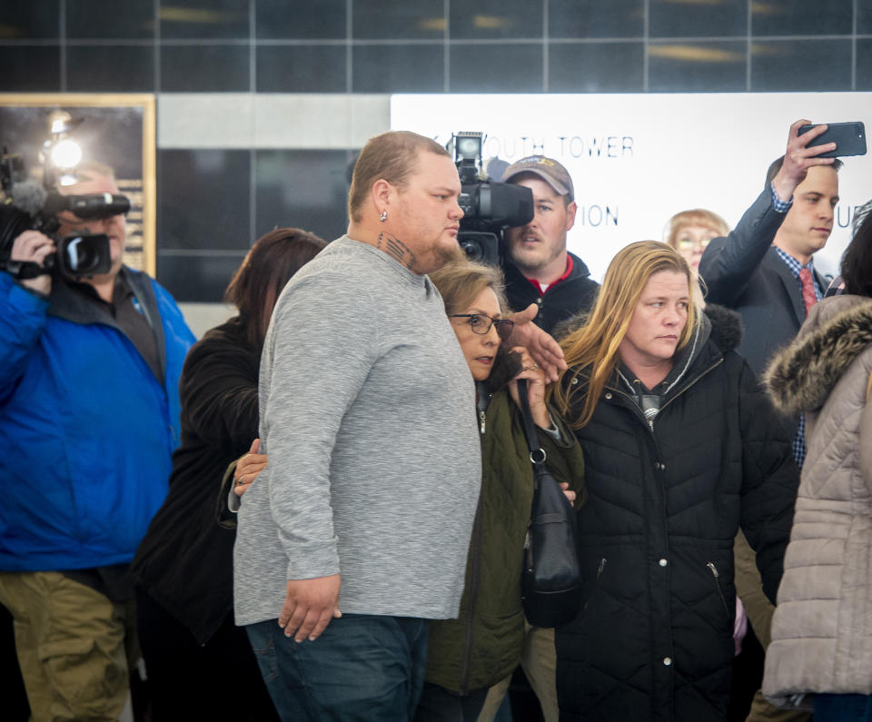 Several members of James Alan Neal's family leave El Paso County's Terry R. Harris Judicial Complex on Thursday, Feb. 21, 2019 in Colorado Springs, Colo. Neal, 72, was arrested Tuesday, Feb. 19, 2019, in Colorado Springs, Colo., and charged with murder with special circumstances in the death of Linda O'Keefe, who was found strangled in 1973, a case that has long shaken the seaside community of Newport Beach, Calif., Orange County District Attorney Todd Spitzer said. (Dougal Brownlie/The Gazette via AP)