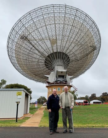 Cooke, senior receiver engineer at the Parkes radio telescope in 1969, and Sarkissian, operations scientist at the telescope, stand together at the Parkes Observatory near the town of Parkes