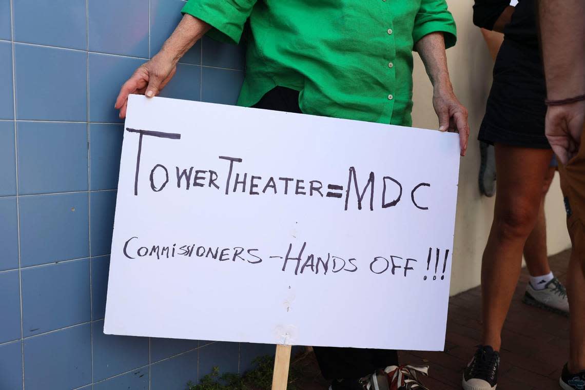 Margarita Batlle, faithful attendee of the theater, holds her sign during the Miami Dade College Tower Theater protest on Tuesday, Oct. 4, 2022, in Little Havana.