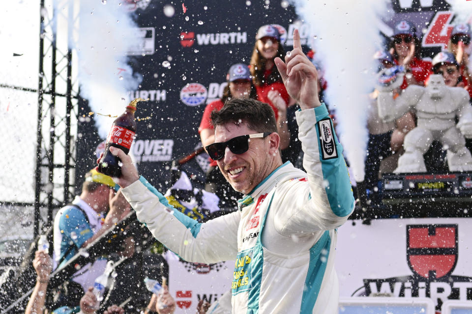 Denny Hamlin celebrates in Victory Lane after winning a NASCAR Cup Series auto race at Dover Motor Speedway, Sunday, April 28, 2024, in Dover, Del. (AP Photo/Derik Hamilton)