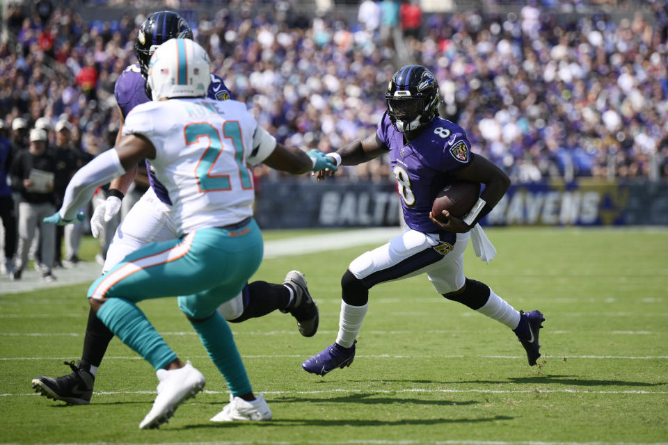 Baltimore Ravens quarterback Lamar Jackson (8) runs the ball during the first half of an NFL football game against the Miami Dolphins Sunday, Sept. 18, 2022, in Baltimore. (AP Photo/Nick Wass)