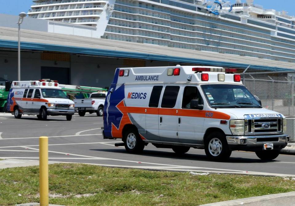 Ambulances are seen coming out of Terminal D after the Coral Princess cruise ship, with 2 deaths aboard, docked at Port of Miami, on Saturday, April 4, 2020.