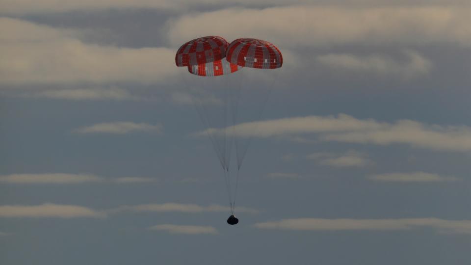 In this photo provided by NASA the Orion spacecraft for the Artemis I mission splashes down in the Pacific Ocean after a 25.5 day mission to the Moon, Sunday, Dec. 11, 2022. (NASA via AP)