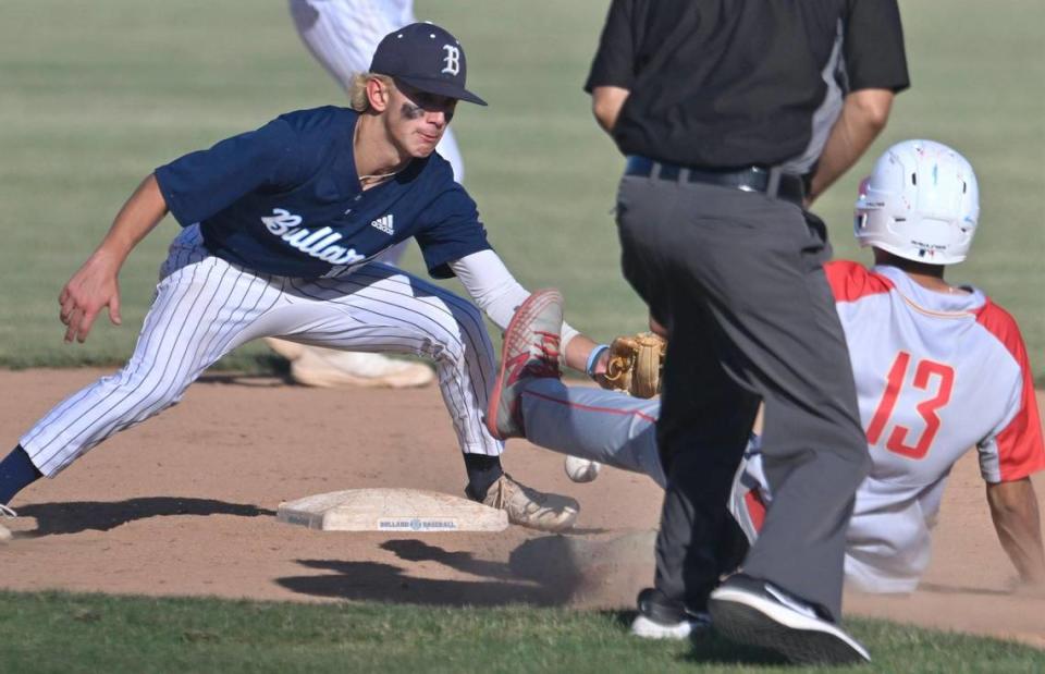 Centennial’s Robert Lopez, right, slides safely to second covered by Bullard’s Vincent Robinson, left, in the Central Section DI baseball quarterfinal Friday, May 19, 2023 in Fresno. Centennial won 6-2.