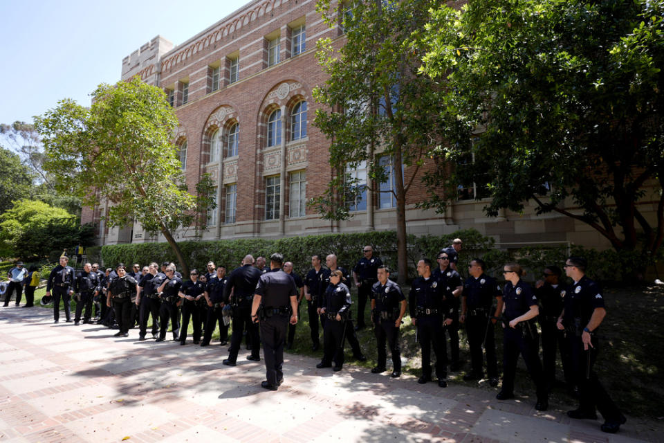 Police stage on the UCLA campus, after nighttime clashes between Pro-Israel and Pro-Palestinian groups, Wednesday, May 1, 2024, in Los Angeles. (AP Photo/Jae C. Hong)