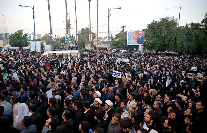 People attend a funeral procession for Soleimani and al-Muhandis, in Ahvaz