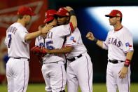 ARLINGTON, TX - OCTOBER 24: Mike Napoli #25 and Neftali Feliz #30 of the Texas Rangers celebrate after defeating the St. Louis Cardinals 4--2 during Game Five of the MLB World Series at Rangers Ballpark in Arlington on October 24, 2011 in Arlington, Texas. (Photo by Rob Carr/Getty Images)