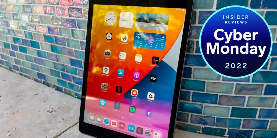 Cyber Monday 2022 iPad deals: The 2021 iPad sitting up, resting against a wall with blue tiles.