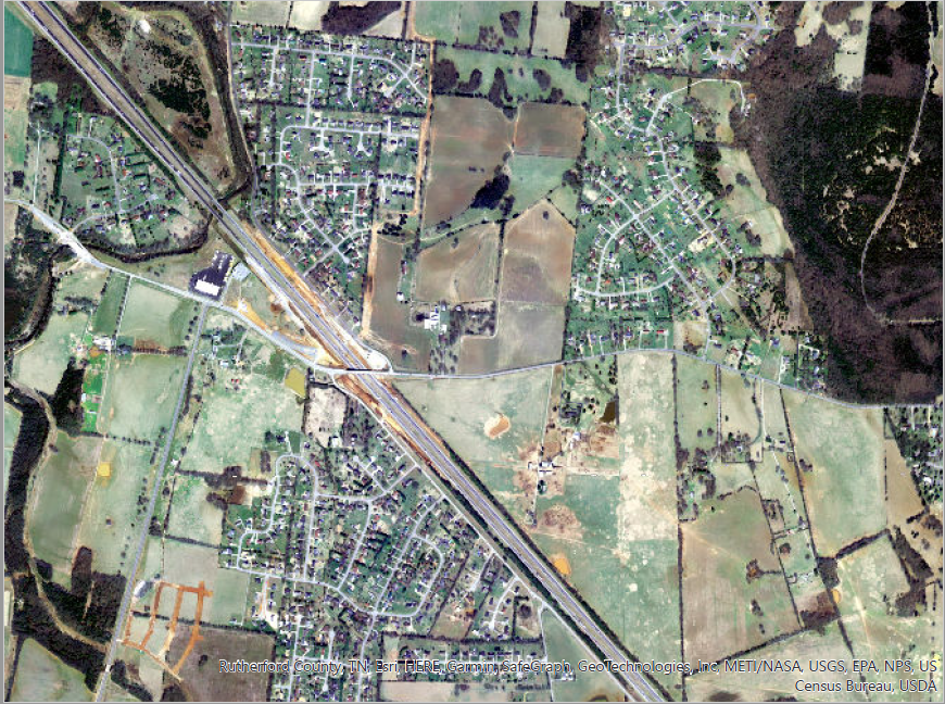 This 2004 aerial image shows the Williamson Family Farm top center prior to Medical Center Parkway opening with an Interstate 24 interchange.