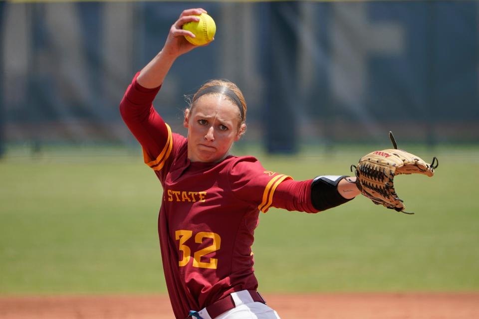 Iowa State's Ellie Spelhaug (32) pitches in the first inning of an NCAA softball game against Oklahoma in the Big 12 tournament Friday, May 13, 2022, in Oklahoma City. (AP Photo/Sue Ogrocki)