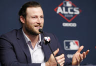 Houston Astros starting pitcher Gerrit Cole talks to the media, Monday, Oct. 14, 2019, at Yankee Stadium in New York on an off day during the American League Championship Series between the Astros and the New York Yankees. (AP Photo/Kathy Willens)