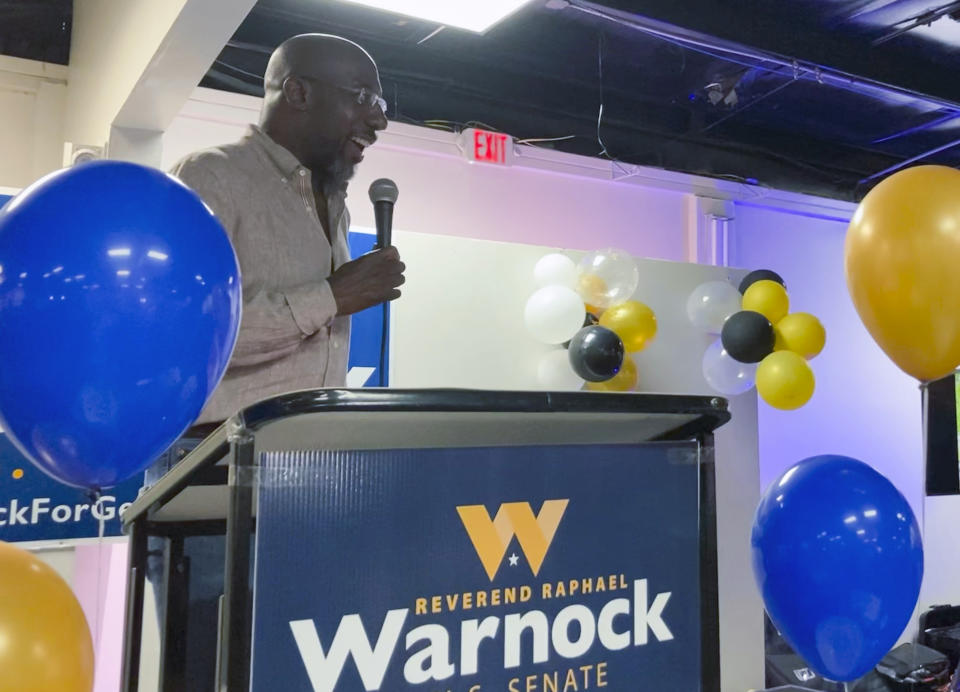 Georgia Sen. Raphael Warnock celebrates his 53rd birthday with supporters in southwest Atlanta as he seeks his first full term in the Senate, July 23, 2022. Warnock won a special election runoff in January 2021 in a completely nationalized campaign with Senate control coming down to two Georgia seats two months after President Joe Biden’s elections. Now, Biden’s political fortunes are down and inflation is up—and Warnock is running a deal-making, bipartisan senator who will “work with anybody” to help his state. He faces Republican challenger Herschel Walker. Warnock is running for his first full Senate term, pitching himself as a lawmaker willing to do whatever it takes to help his state. (AP Photo/Bill Barrow)