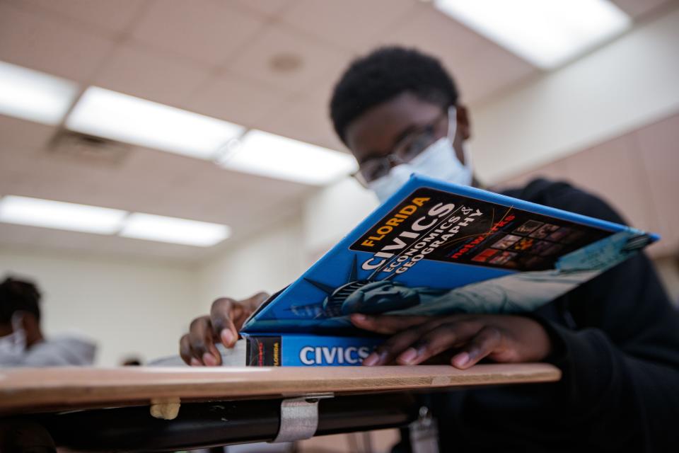Travis Williams works on a civics packet at Nims Middle School on Thursday, Jan. 20, 2022.