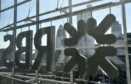 FILE PHOTO: The City of London business district is seen through windows of the Royal Bank of Scotland (RBS) headquarters in London, Britain, in this September 10, 2015 file photo. REUTERS/Toby Melville