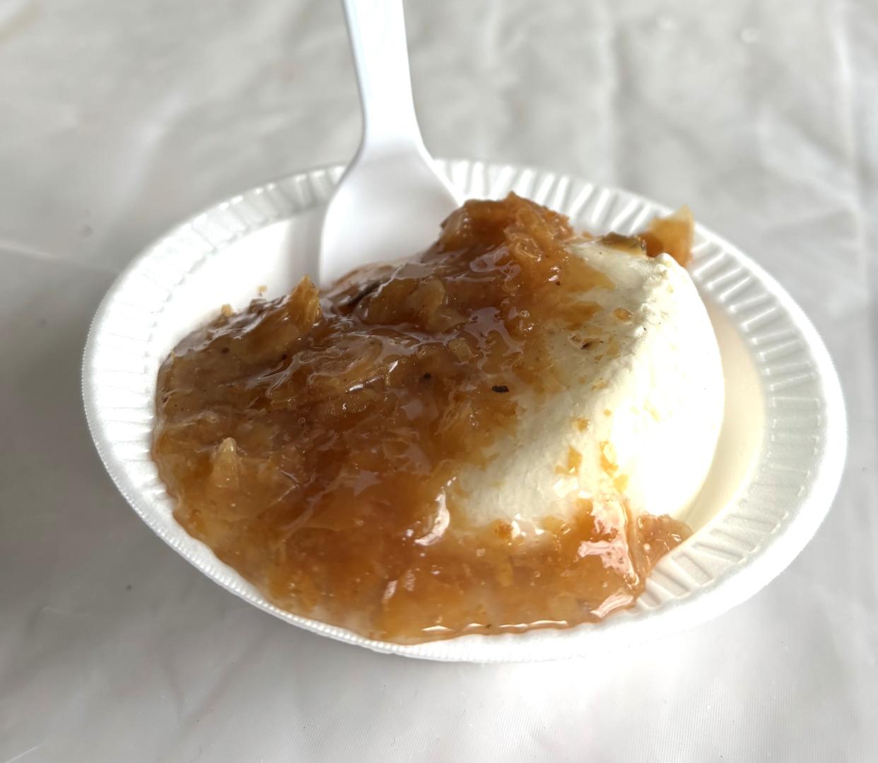 Baklava ice cream is a dish with baklava pieces and syrup served on top of vanilla ice cream at the 2024 Wilmington Greek Festival.